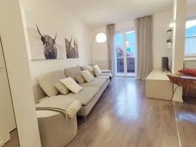 a living room with a couch and a table at Charmante Wohnung in Zentrum von Nals in Nalles