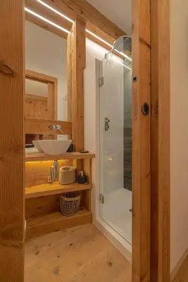 a bathroom with a shower and a sink at Casa Betulla in Cortina dʼAmpezzo