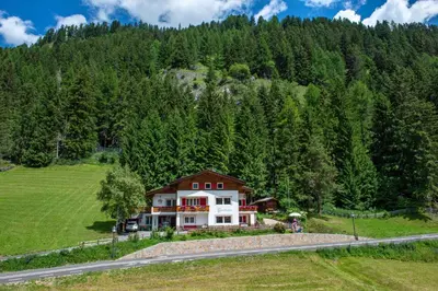 an aerial view of a house in the mountains at Apartments Vintlana in Selva