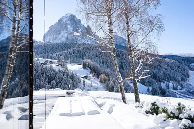 a view of a mountain with snow on the ground at Chalet Villa Carolina in Selva di Val Gardena