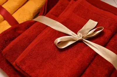 a red sweater with a white bow on it at Mansarda Le Genziane di Fiemme in Cavalese