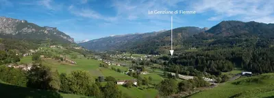 a view of a valley with mountains in the background at Mansarda Le Genziane di Fiemme in Cavalese