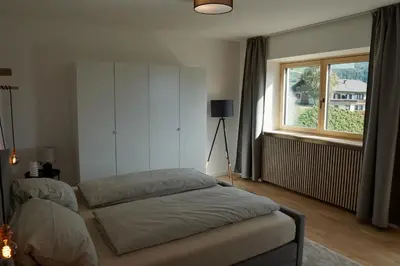 a bedroom with two beds and a window at Villa Vitis in Rifiano
