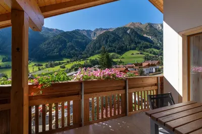 a balcony with a view of the mountains at Haus Alpenjuval in Fundres