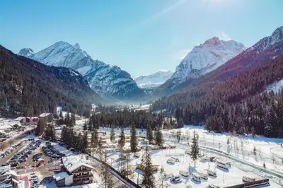 an aerial view of a ski resort in the mountains at Albergo Canazei in Canazei