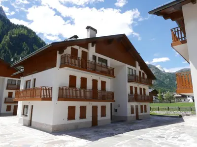 a large white building with balconies on it at Residence Molin in Rocca Pietore