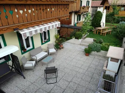 an overhead view of a patio with chairs and a table at Ciasa Rossi in Soraga