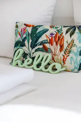 a pillow with the word relax written on it at Italyescapes Emma 11 in Merano
