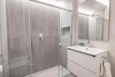 a bathroom with a shower and a sink at Italyescapes Emma 11 in Merano