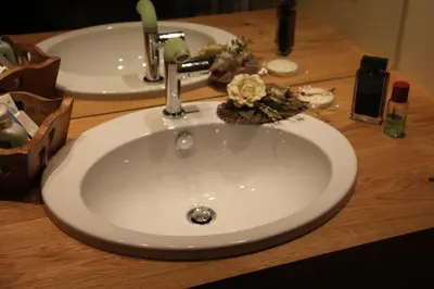 a sink in a bathroom with two mirrors and a sinkyss at Relax Home Fie' allo Sciliar - Alpe di Siusi Val Gardena in Fiè
