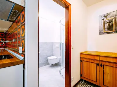 a bathroom with a toilet and a glass shower at Apartment Cesa Minach-2 by Interhome in Alba di Canazei