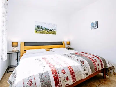 a living room with a bed and a couch and a tv at Apartment Cesa Minach-3 by Interhome in Alba di Canazei