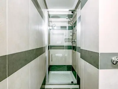 a small bathroom with a shower and a toilet at Apartment Torrita di Canazei by Interhome in Alba di Canazei