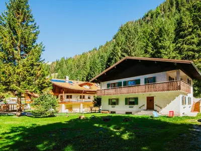a large house in the middle of a green field at Apartment Cesa Minach-1 by Interhome in Alba di Canazei