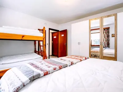 a bedroom with two bunk beds in it at Apartment Cesa Minach-1 by Interhome in Alba di Canazei