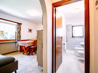a bathroom with a shower and a toilet and a sink at Apartment Cesa Minach-1 by Interhome in Alba di Canazei