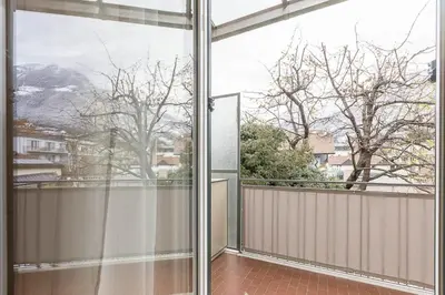 an open balcony with a view of a mountain at Appartment Lissi in Merano