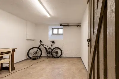 a bike parked in a room with a window at Appartment Lissi in Merano