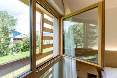 a room with windows in a house with a view at Casa Erika in San Lorenzo di Sebato