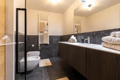 a bathroom with a sink and a toilet at Casa Erika in San Lorenzo di Sebato