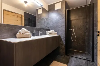 a bathroom with a sink and a shower at Casa Erika in San Lorenzo di Sebato