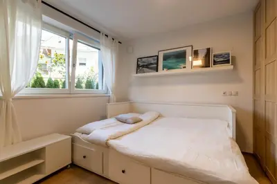a small bedroom with a bed and a window at Casa Fiammetta in Brunico