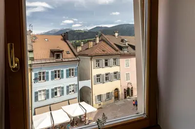a view of a city from a window at Central Attic - City view in Brunico