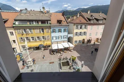 a view from a window of a city with buildings at Central Attic - City view in Brunico
