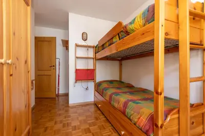 a bedroom with bunk beds in a house at Casa Blue Sky in Moena