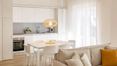a living room with a white table and a couch at Italyescapes Maia in Merano