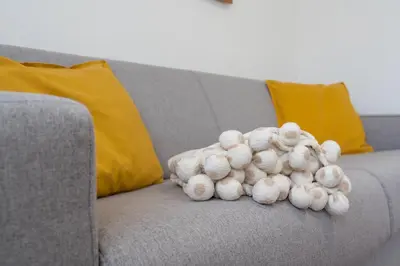 a pile of stuffed animals sitting on a couch at Dolomitihouse FAGHER in Fiera di Primiero