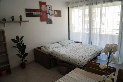 a bed in a room with a window at Casa Ricky in Bolzano