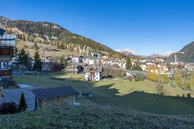 a view of a small town in the mountains at Cesa te Val in Vigo di Fassa