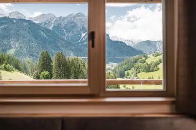 a window with a view of a mountain view at Biohof Untergröber in Braies