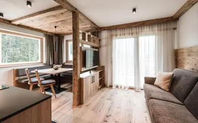 a living room with a couch and a table at Biohof Untergröber in Braies