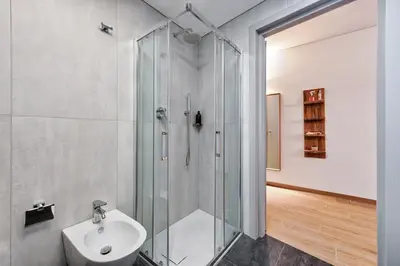 a bathroom with a shower and a sink at Lauben Flat Bolzano in Bolzano