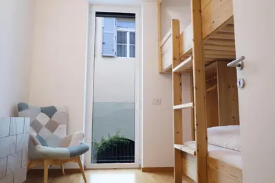 a small room with a bunk bed and a staircase at Apartment Lauben - Alpstay in Merano