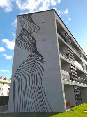 a building with a painting on the side of it at Apartment Ando in Brunico