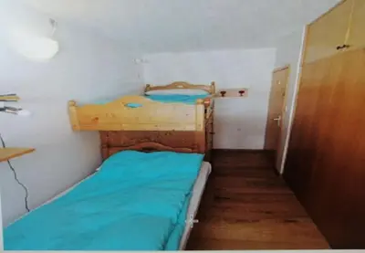 a small room with two bunk beds in it at La casa di Antonello Chiara Alessandro e Ginevra in Malga Ciapela