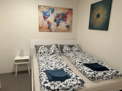 a bedroom with a bed and a sink and a mirror at Casa Sciliar Stanza privata gold in Fiè