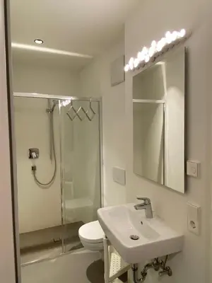 a bathroom with a toilet and a sink and a shower at Casa Sciliar Stanza privata gold in Fiè