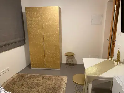 a door in a room with a brick floor at Casa Sciliar Stanza privata gold in Fiè
