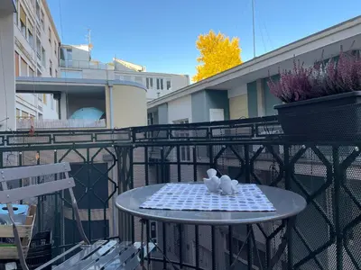 two white birds sitting on a table on a balcony at Haus Gugler in Bolzano
