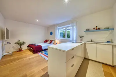 a kitchen with a sink and a bed in a room at HOMESTWENTY3 - Home one in Caldaro