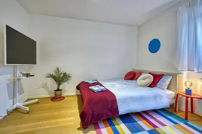 a bedroom with a bed and a tv in it at HOMESTWENTY3 - Home one in Caldaro