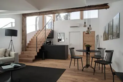 a living room with a couch and a table at Attica 54 Apartments Merano in Merano