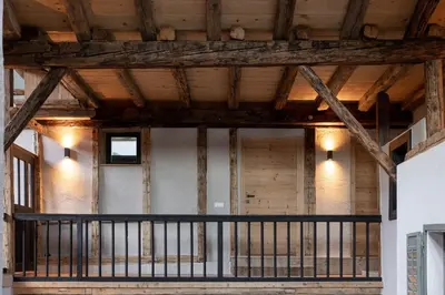 a view of the inside of a building with wooden ceilings at Attica 54 Apartments Merano in Merano