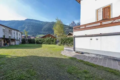 a view of a yard with a building at Cesa Meida 2B in Pozza di Fassa