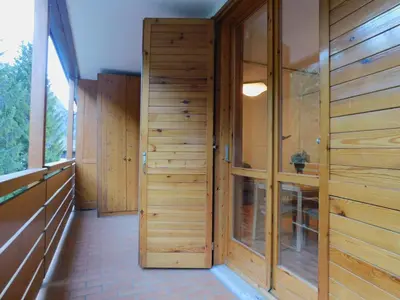 a room with wooden walls and a walk in shower at Loft a Canazei vicino alle piste vista Marmolada in Alba di Canazei