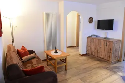 a living room with a couch and a table at Haus Fulterer in Siusi